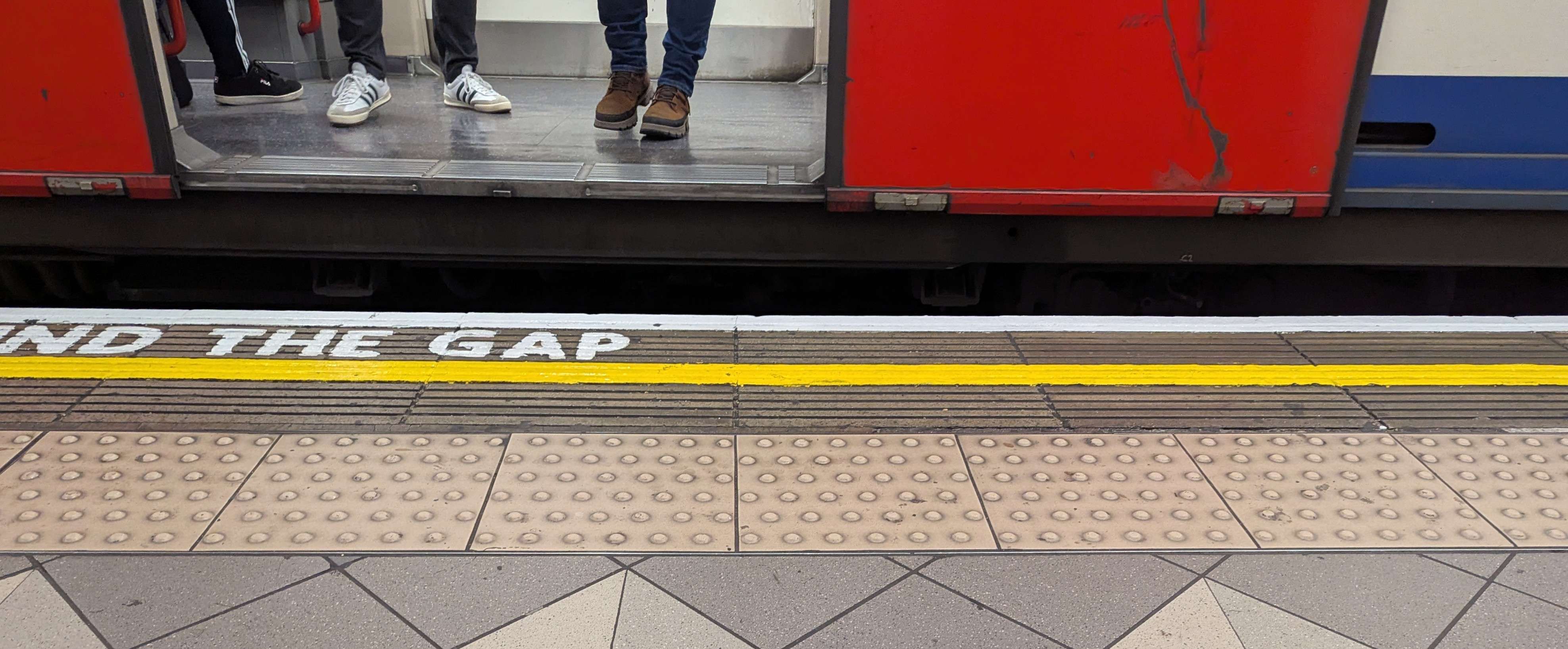 A large gap between the platform and a Central Line train at Bank station. The gap is approximately 30cm wide with a step up of about 15cm.